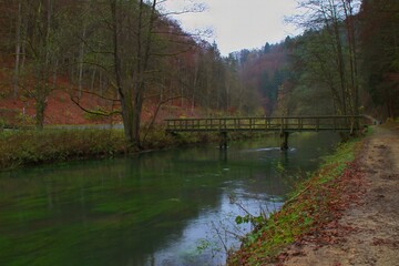 wooden bridge across the pegnitz river in landscape countryside of nuremberg land near rupprechtstegen