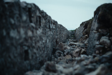 Old World War 1 trenches on top of the Italian alps during a foggy day