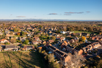 Aerial photo of the beautiful British town of Bedale which is a market town in the Hambleton former district of North Yorkshire in the UK showing houses and housing estates in the Autumn time