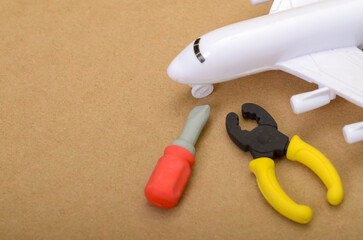 Airplane with Service Tools, Representing Aviation Maintenance and Repair Industry