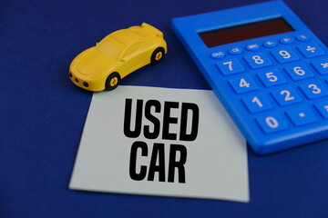 miniature of car and blue background with the word USED CAR