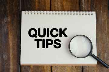 text TIPS on wooden block on wood background