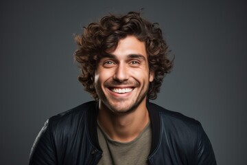 Excited curly haired man portrait adult smile.