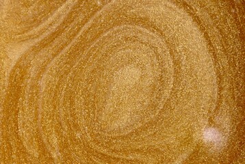 Shiny golden texture background. Golden surface pettern. top view.