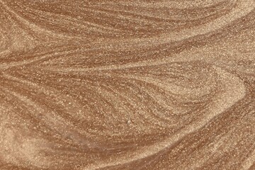 Texture of the sand. Shiny golden texture background. Golden surface pettern. Top view.