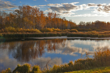 blue lake in the autumn forest, Siberia, Russia