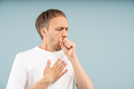 Unwell man struggles with persistent coughing, holding chest by sharp pain. Respiratory health problems, symptoms pneumonia, asthma attacks, allergy-induced cough with discomfort, difficulty breathing