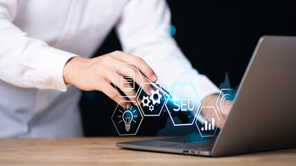 Marketer showing SEO concept,optimization analysis tools, search engine rankings, social media sites based on results analysis data,Website Search Optimization ,Interesting web rankings from visitors