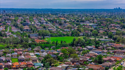 Panoramic aerial drone view of western Sydney Suburbs of Canterbury Burwood Ashfield Marrickville Campsie with Houses roads and parks in Sydney New South Wales NSW Australia