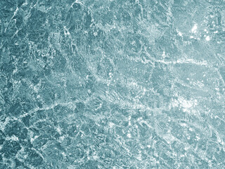 Clear water surface, ripple water in the sea with sun reflection