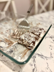 Turkish Dessert Saray Sarma Chocolate pudding with cream and coconut powder.