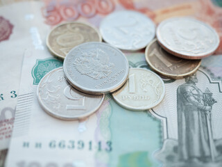 Stack of Russian Banknotes and Coins on a Table