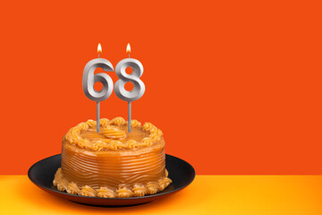 Birthday candle number 68 - Cake with dulce de leche frosting.