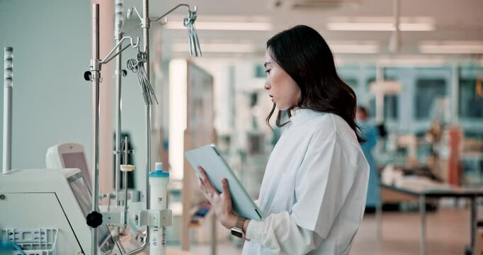 Asian woman, doctor and monitoring with tablet for research, study or medical apparatus at hospital. Japanese, female person or healthcare worker with technology for digital results at clinical lab