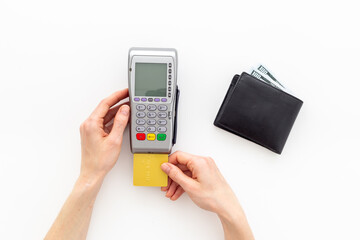 Female holding in hands bank payment terminal for contactless payment by credit cards, top view