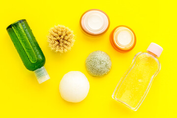 Flat lay of cosmetic products for skin care and moisturizing, top view. Bottles and jar of cream