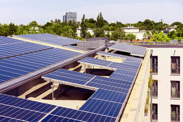 Solar panels on House Roof. Modern High-rise Residential Apartment Building with Solar Panel...