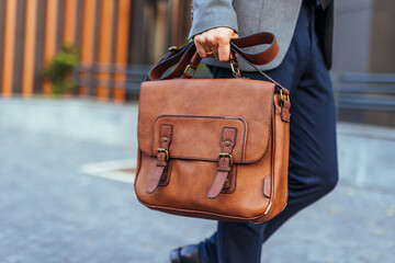 Businessman Carrying Leather Briefcase on City Street