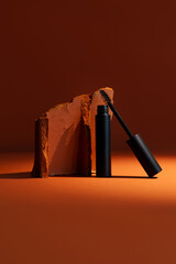 Close-up mockup of empty smooth mascara with delicate brush on soft, blurry, expensive background. Elegant brick effect adds a touch of luxury, perfect for beauty and makeup themes.