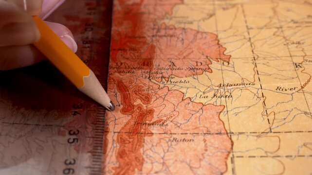 Geographer measures distance on map