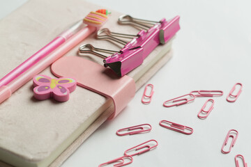  A vibrant collection of office and school supplies, including scissors, pens, sticky notes, paper...