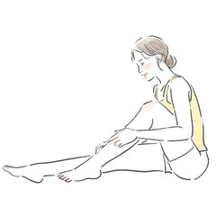 足のマッサージをしている若い女性の全身