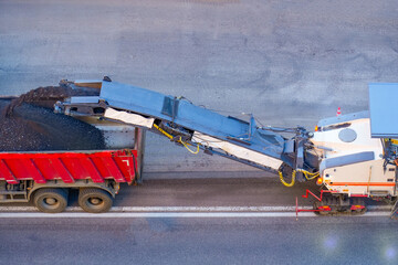 Asphalt removal repair using asphalt cutting and combine loading into truck body