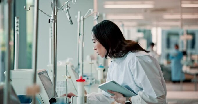 Doctor, woman and check for dialysis equipment with tablet, click or inspection in hospital for wellness. Japanese person, medic and digital touchscreen with machine, healthcare and service at clinic