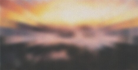 Soft, blurred sunset with gentle pastel tones of yellow, orange, and pink fading into dark silhouettes, creating a peaceful and artistic atmosphere