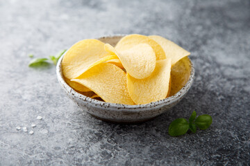 Traditional potato chips in a bowl