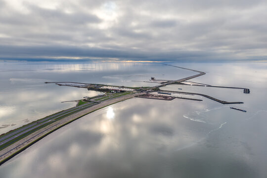 Aerial of sea wall, dike, afsluitdijk with locks in IJsselmeer lake