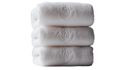 Three white towels are stacked neatly, each with a flower design embossed on the front.