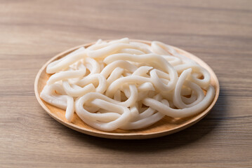 Udon noodles on wooden plate, Thick noodles in Japanese cuisine
