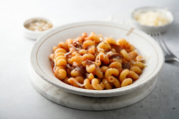 Pasta with tomato sauce and smoked ham