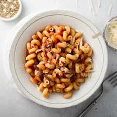 Pasta with tomato sauce and smoked ham