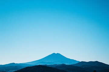 Majestic Blue Horizon: The Tranquil Presence of a Mountain