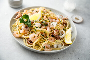 Spaghetti with seafood, parsley and lemon