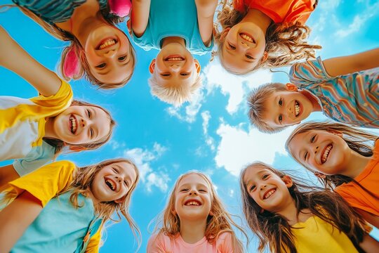 Happy young friends enjoying outdoor time together under blue sky 