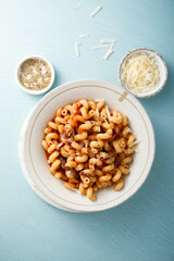 Pasta with tomato sauce and smoked ham