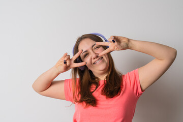 Modern woman smiling with braces on her teeth and listening to music