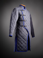 Historical fashion. Medieval knight cloth. Padded jacket gambeson.