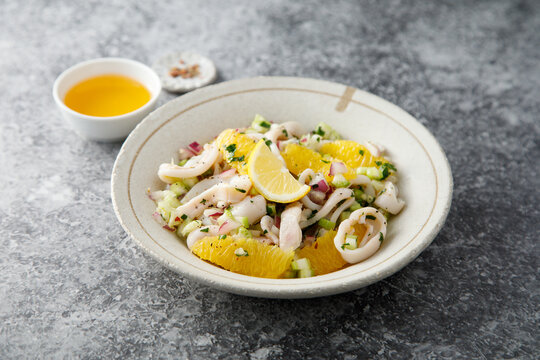 Squid salad with orange and red nion
