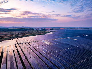 Solar photovoltaic panels array aerial photography at sunset