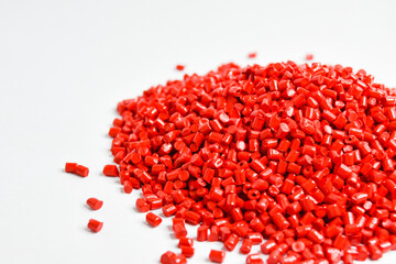 Cold cut type red masterbatch granules isolated on a white background,color pigment carrier polymer in plastic industry.Suitable for plastic company catalogue