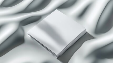 Folded bifold white business card mockup set against a soft, textured surface, showcasing subtle shadows for depth and realism.