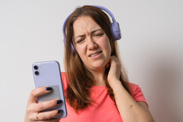 Modern woman smiling with braces on her teeth and listening to music