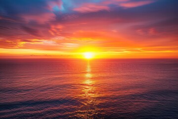 Obraz premium Ocean Sunset Reflects Golden Light on Water with Colorful Sky Gently