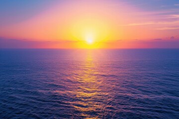 Obraz premium Golden Sunset Reflects on Calm Ocean Waves at Dusk