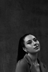 Black and white photo of a girl in classic clothes posing on the streets of Bangkok.