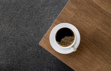 Minimalist White Coffee Cup on Wooden Table. top view